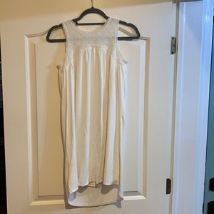 Girl’s white/off white sleeveless dress.